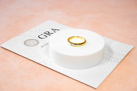 BOLD GOLDEN BAND WITH A BAGUETTE-CUT MOISSANITE CENTERPIECE