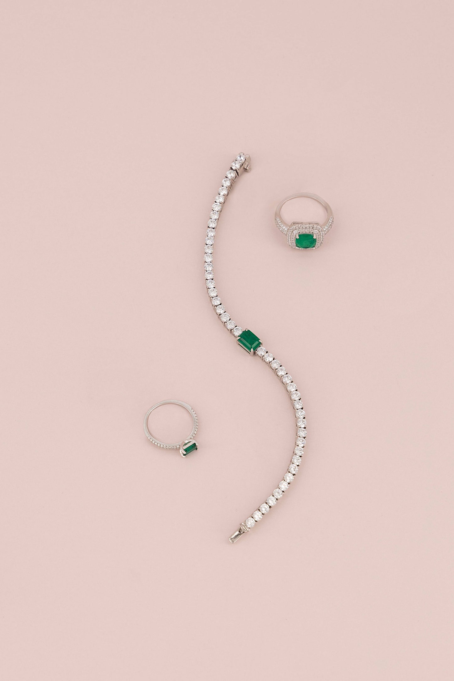 THIN FANCY ETERNITY BAND WITH RECTANGULAR EMERALD