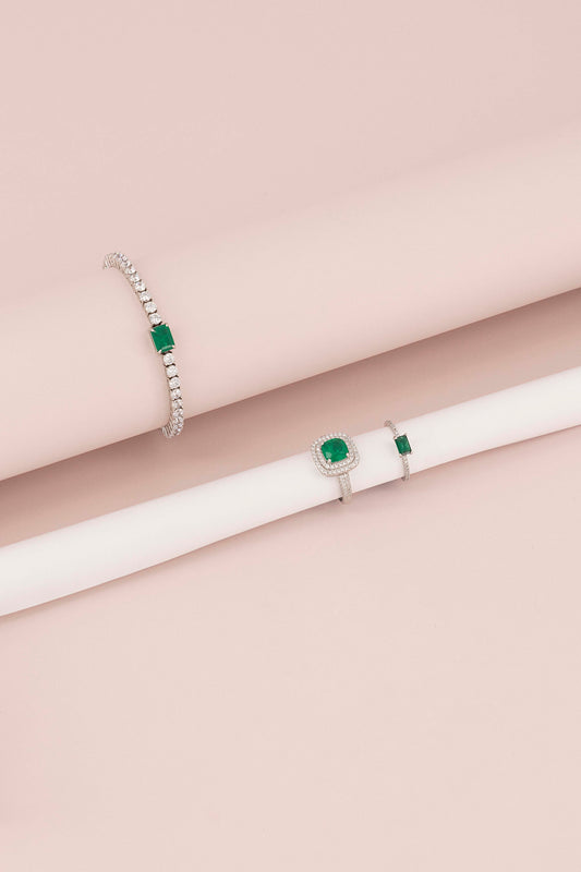 THIN FANCY ETERNITY BAND WITH RECTANGULAR EMERALD