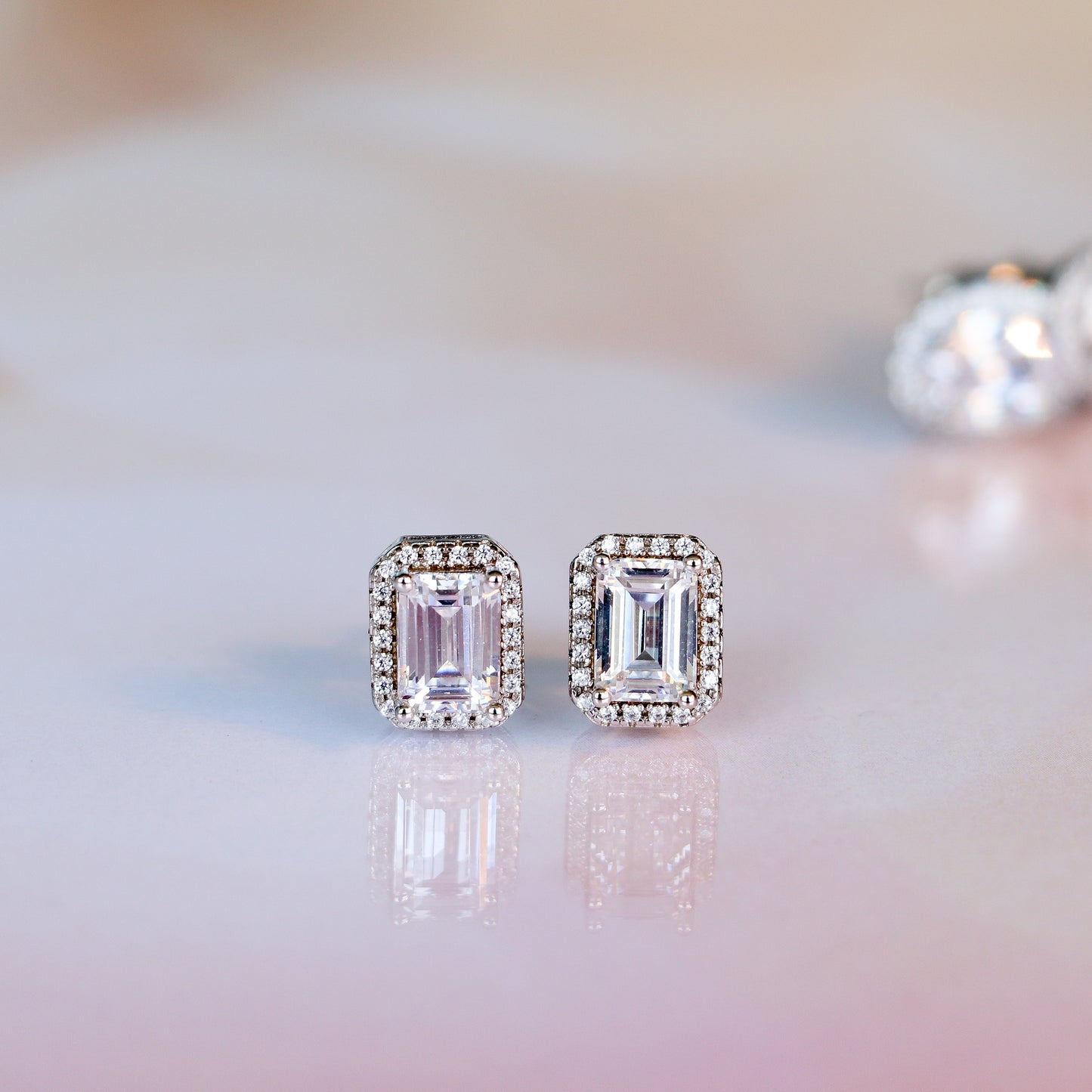MOISSANITE EMERALD CUT STUDS WITH HALO